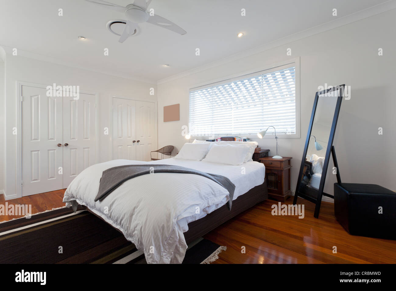 Stylish double bedroom in modern Australian home Stock Photo Alamy