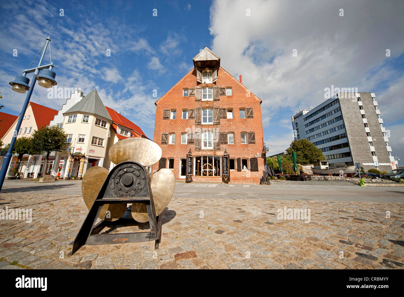 Ship's propeller and warehouse building at the old harbour in Wolgast