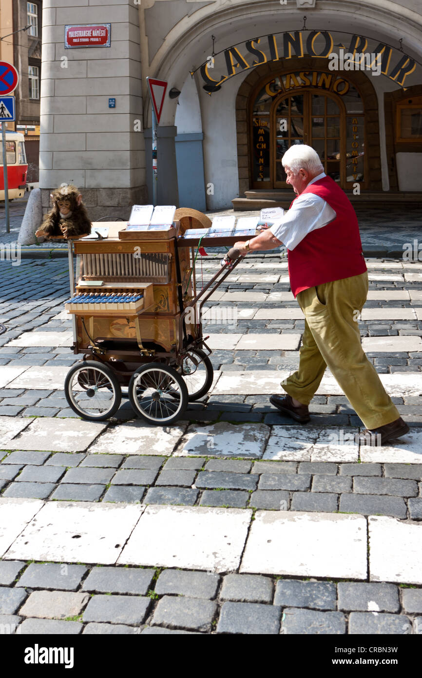 Town musician with an old barrel organ, Prague, Czech Republic, Europe Stock Photo