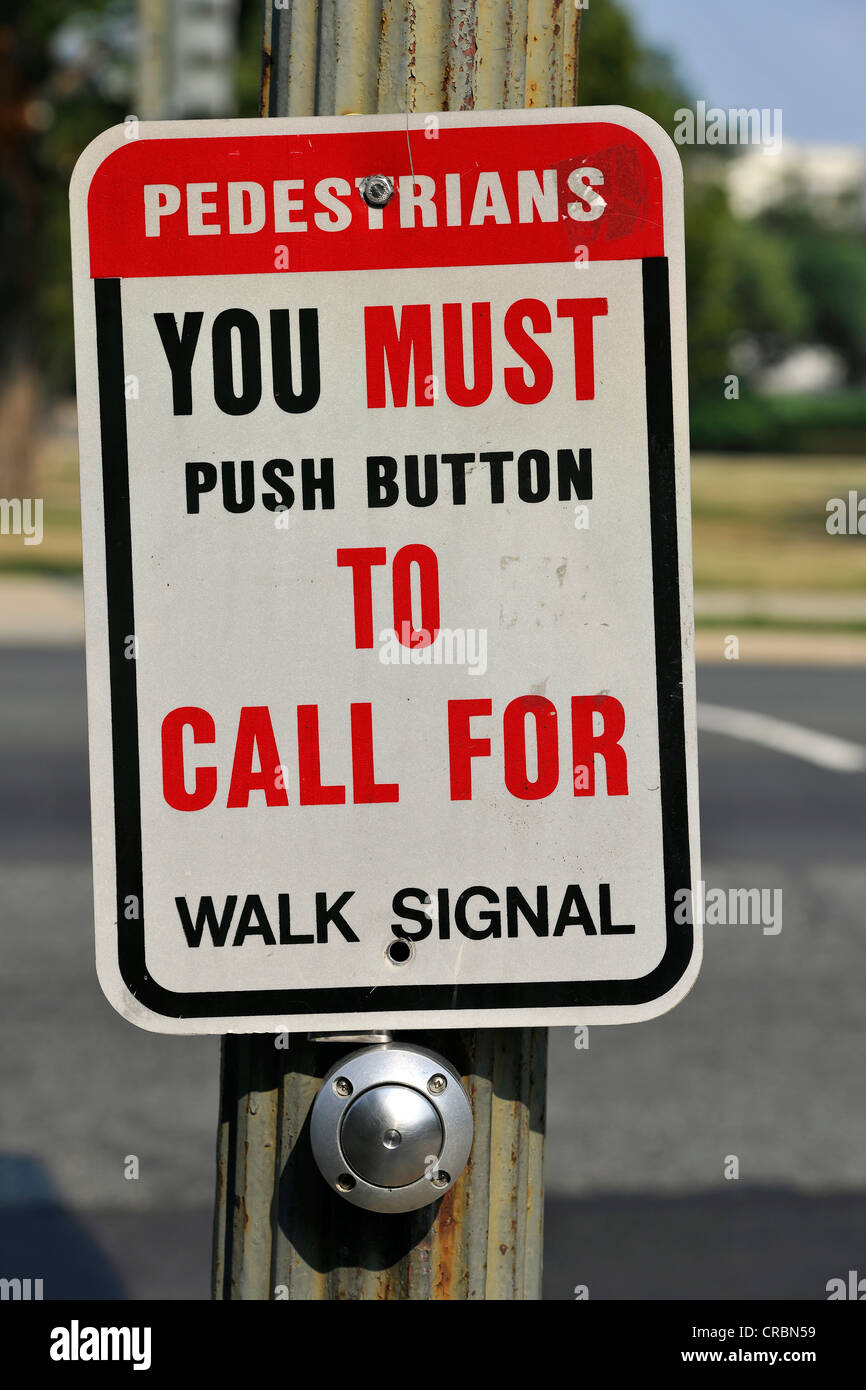 Sign, pedestrians must push the buttons to call for the walk signal, Washington DC, District of Columbia, USA, PublicGround Stock Photo