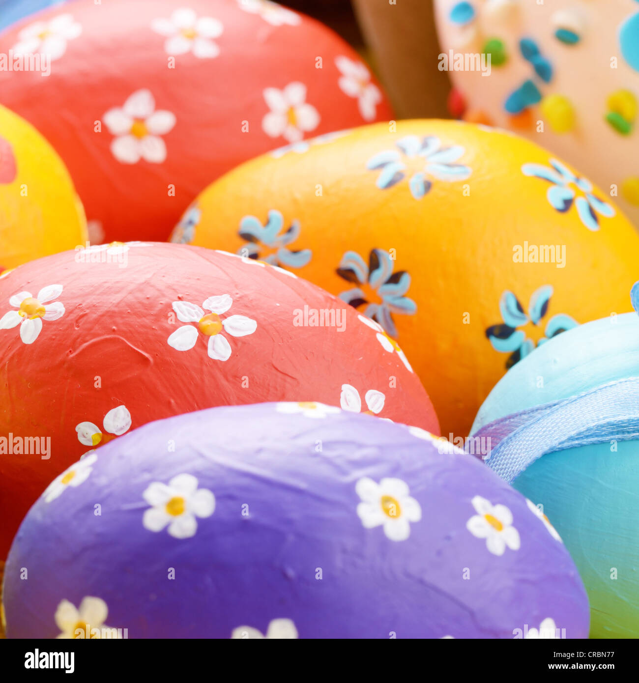Painted easter eggs with bows background Stock Photo