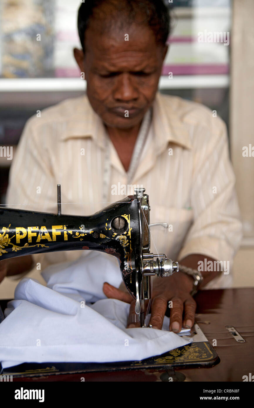 Dressmaker working with an old Pfaff sewing machine, Kandy, Sri Lanka, Indian Ocean Stock Photo