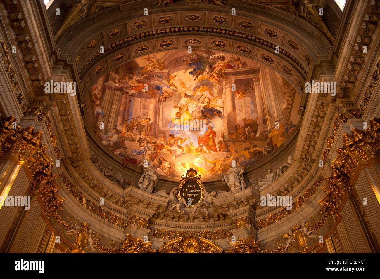 Ceiling painting and inscription 'Ego vobis ae propitius ero' or 'you will be favored in e' in the Jesuit Church of Saint Stock Photo