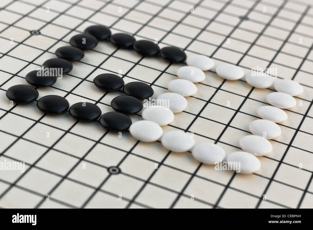 Traditional Chinese, Japanese, Korean Board Game - Go (Weigi - Igo - Baduk - Encircling Game) Stock Photo