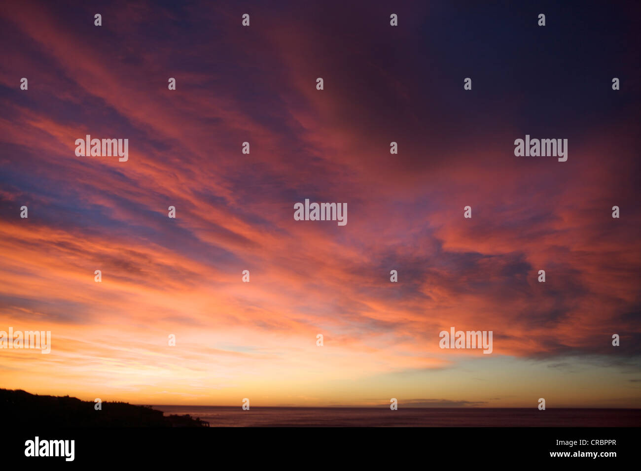 Colorful clouds in sunset sky Stock Photo - Alamy