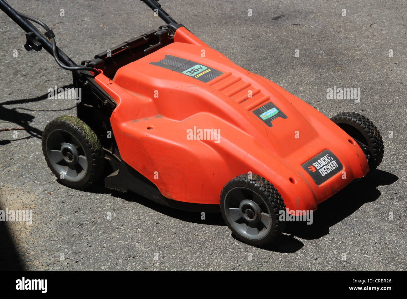 https://c8.alamy.com/comp/CRBR26/orange-rechargeable-lawn-mower-CRBR26.jpg