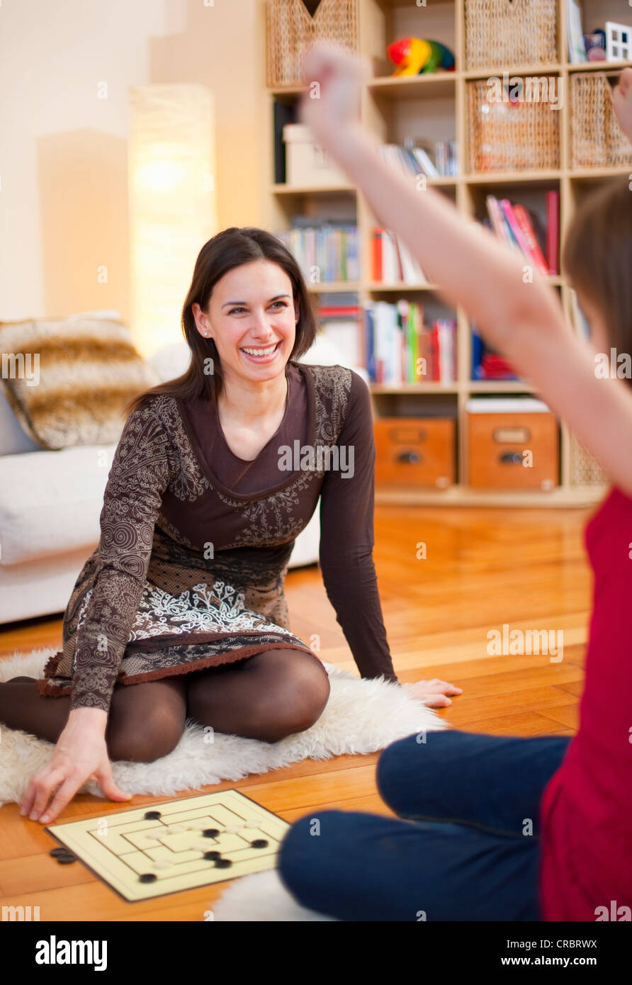 Mother and daughter playing board game Stock Photo Alamy