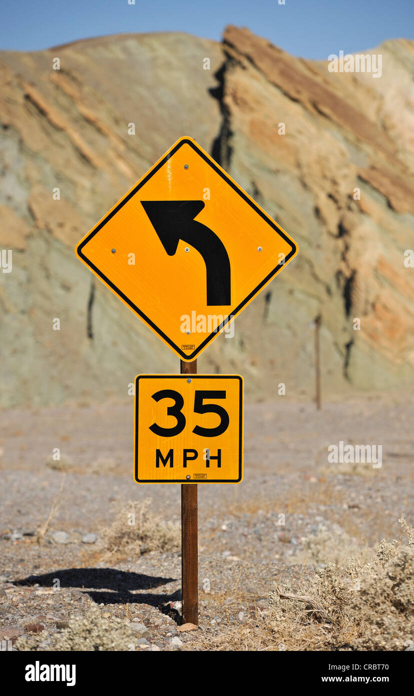Traffic sign, curve ahead and 35 mph speed limit, Death Valley National Park, Mojave Desert, California Stock Photo