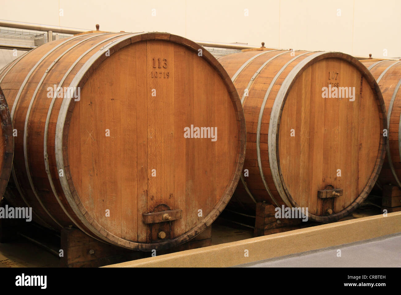 Two large oak barrels for liquor storage, Aalborg Akvavit spirits factory, Aalborg, North Jutland, Denmark, Europe Stock Photo