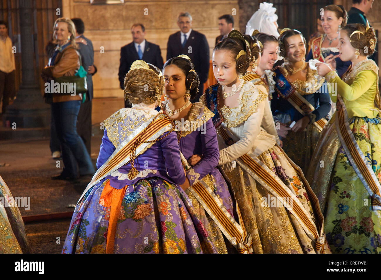 Falleras Mayores Infantiles, bun hairstyles and decorated with brocade, Fallas festival, Falles festival in Valencia in early Stock Photo