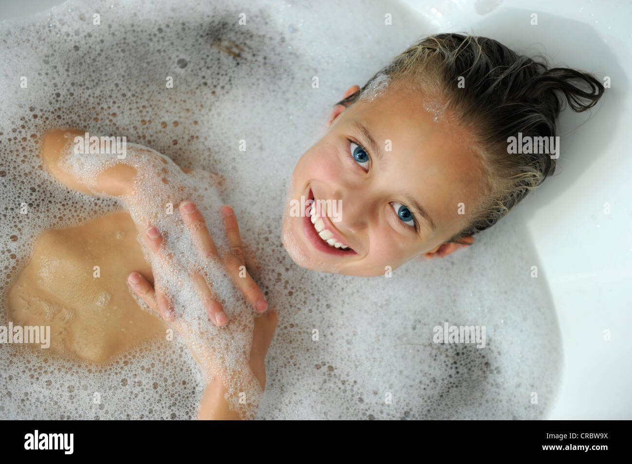 Young girl in a bathtub Stock Photo