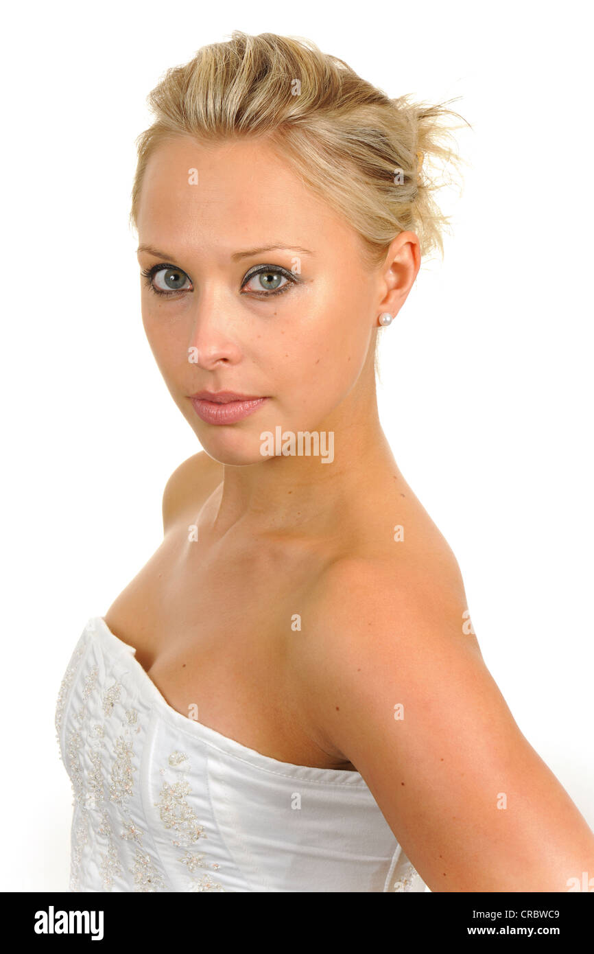 Young woman wearing a white strapless top, portrait Stock Photo