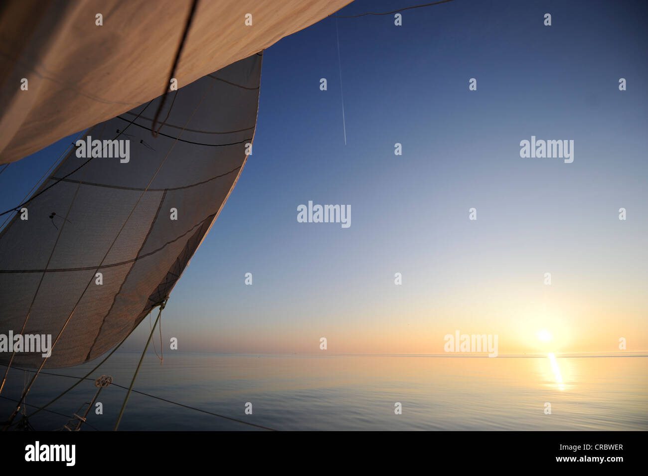 Sailing with no wind, sunset, IJsselmeer, Netherlands, Europe Stock Photo