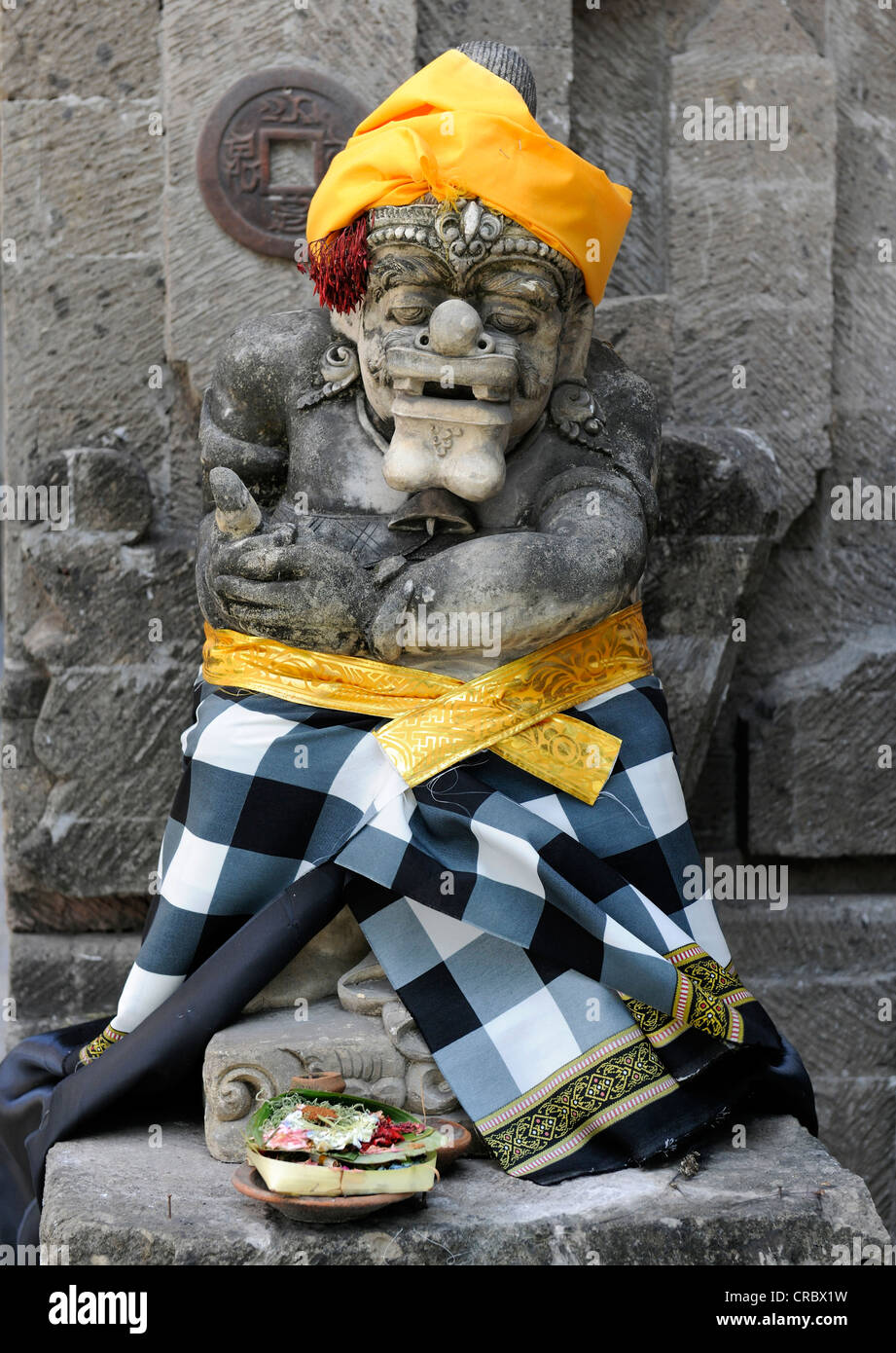 Religious sculpture with offerings, Denpasar, Bali, Indonesia, Southeast Asia Stock Photo