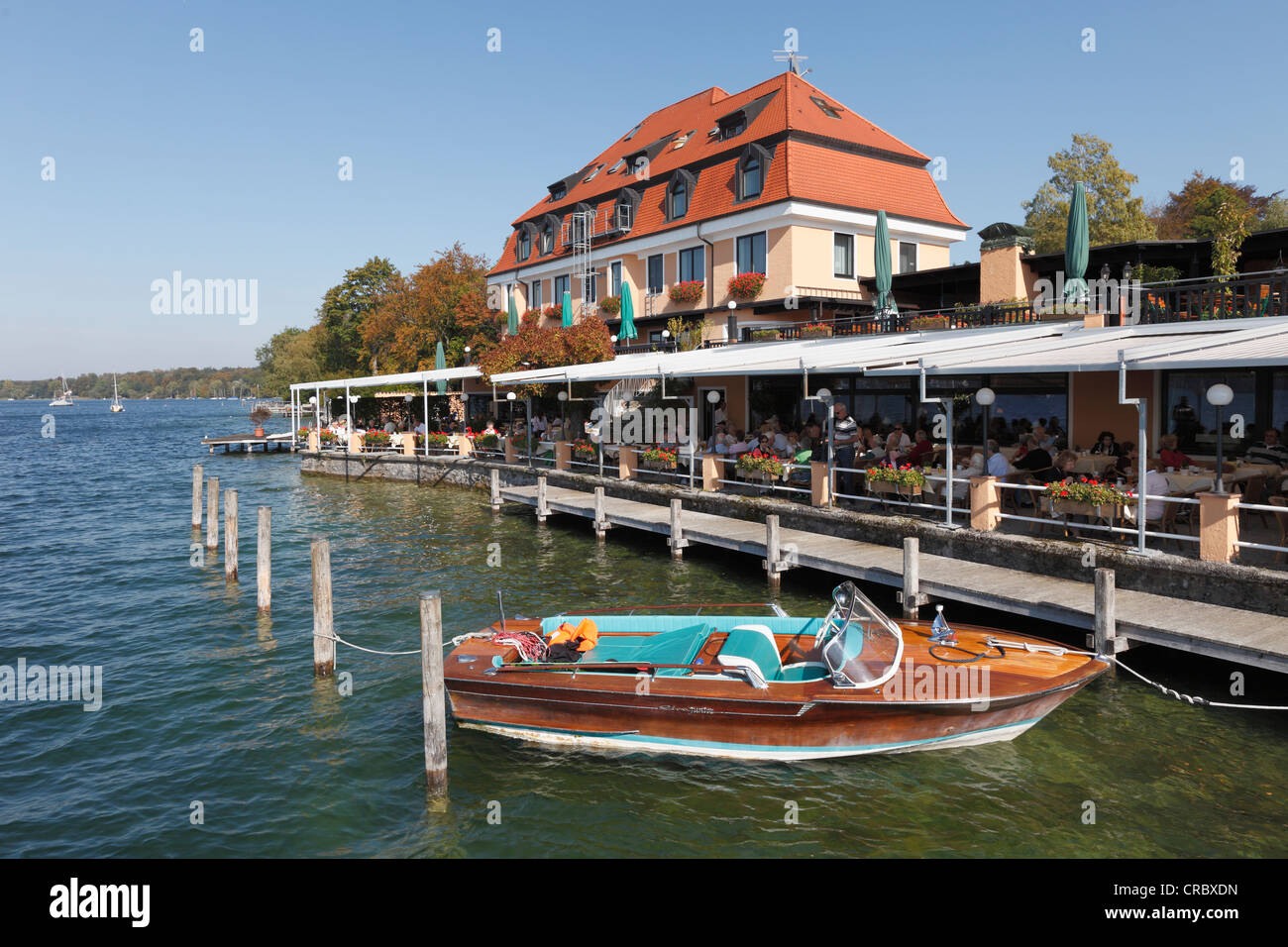 Boat in front of Hotel Schloss Berg on Lake Starnberg, Berg, Fuenfseenland, Five Lakes district, Upper Bavaria, Bavaria Stock Photo