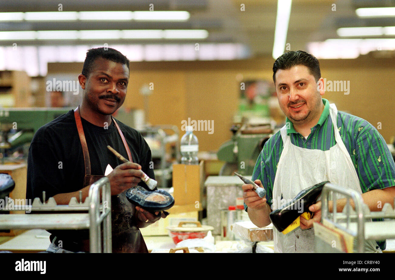 Portrait of a white and a black laborer, Schoenenwerd, Switzerland Stock Photo