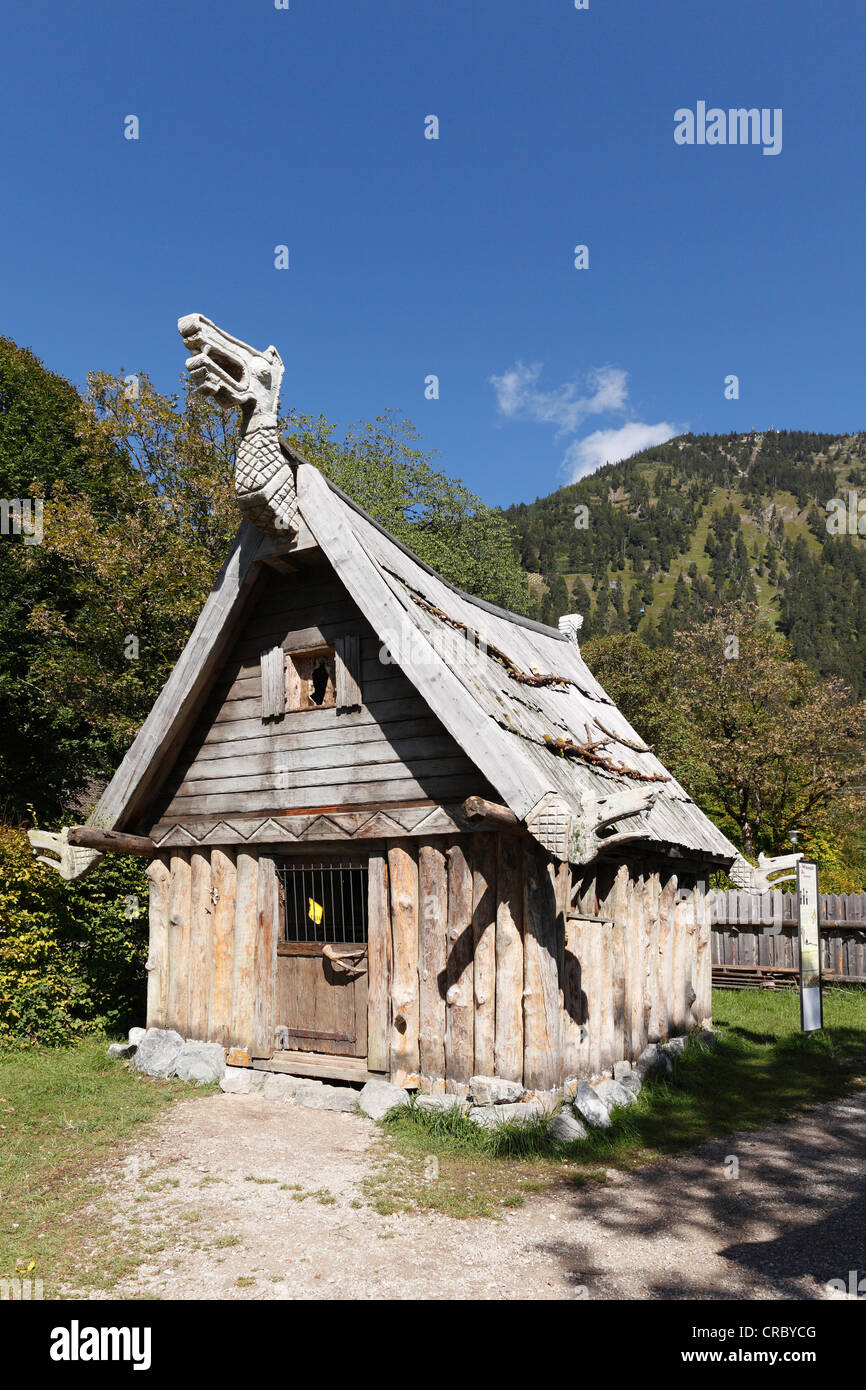 Wooden hut at the Flake Viking village on Lake Walchen, Herzogstand mountain at the back, Upper Bavaria, Bavaria Stock Photo