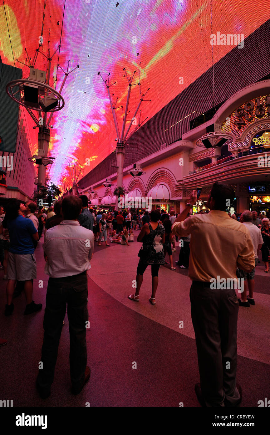 Tourists marveling at the neon dome of the Fremont Street Experience in old Las Vegas, downtown Las Vegas, Nevada Stock Photo