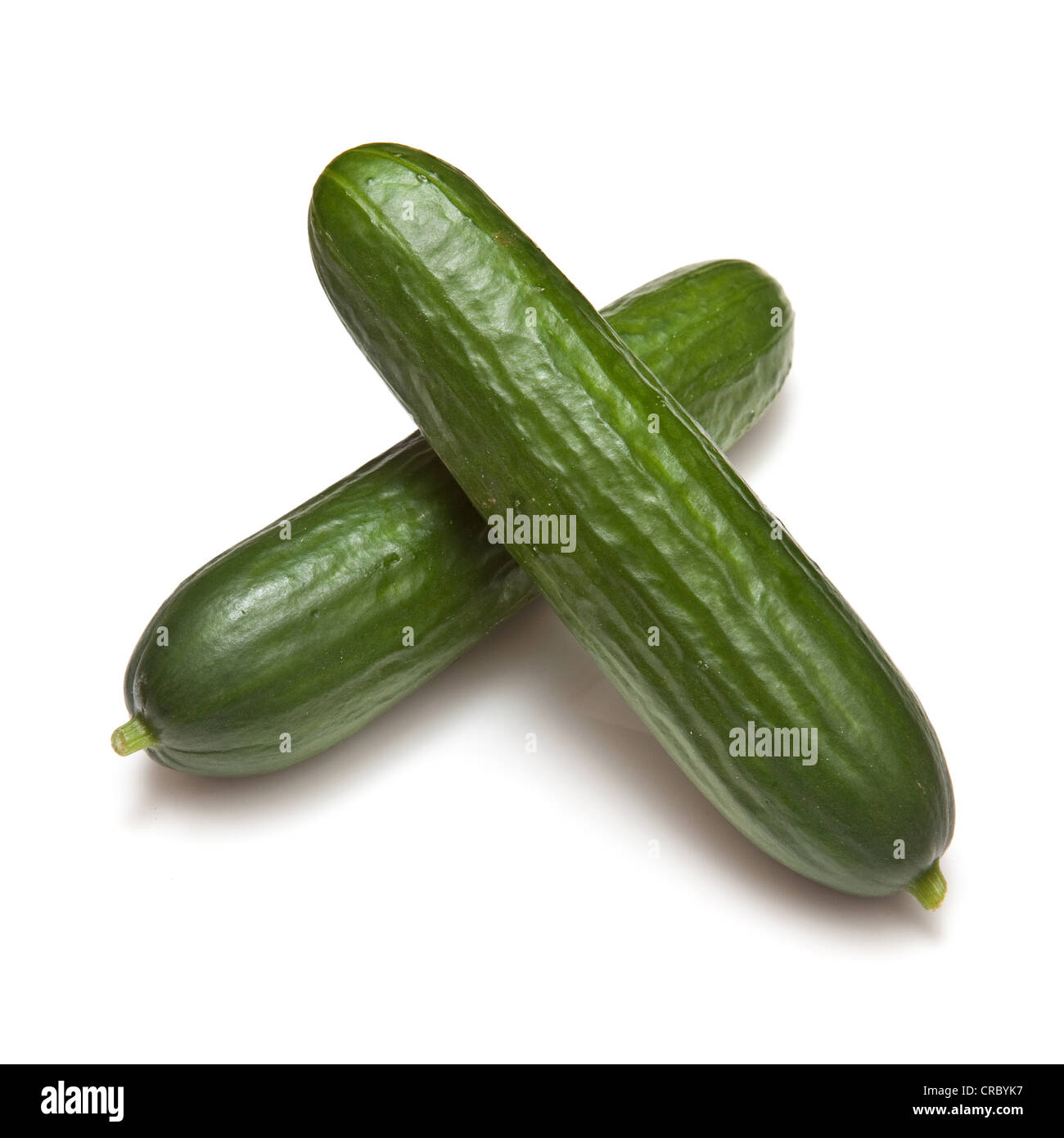 Fresh long and mini cucumbers on burlap Stock Photo by ©thodonal