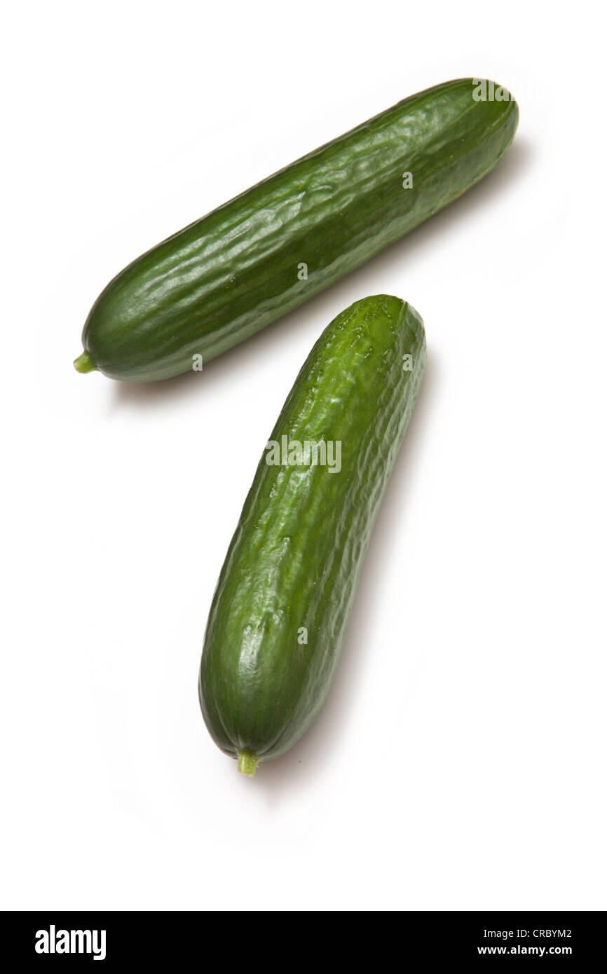 Fresh long and mini cucumbers on burlap Stock Photo by ©thodonal
