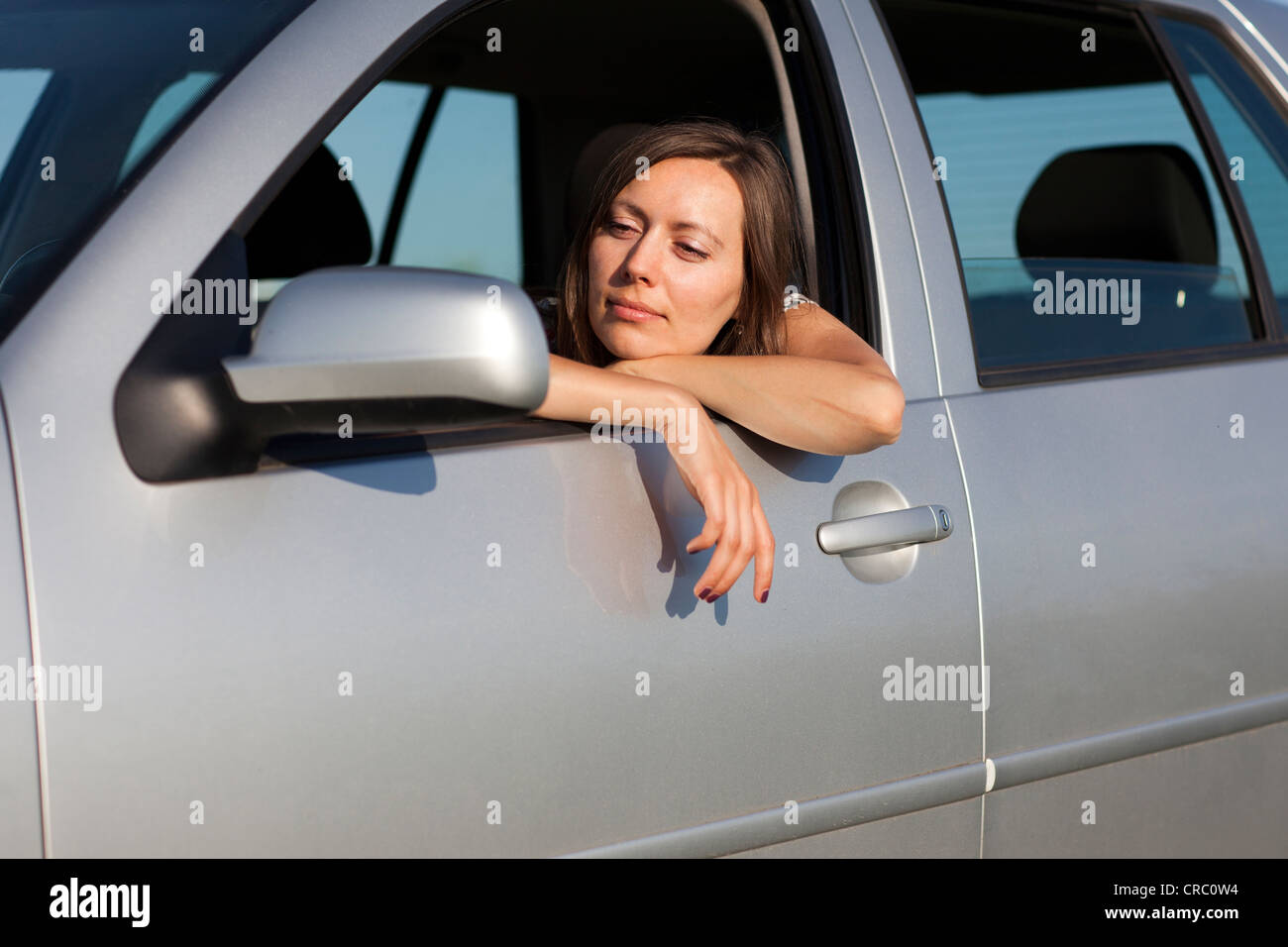 Woman happy in car Stock Photo - Alamy