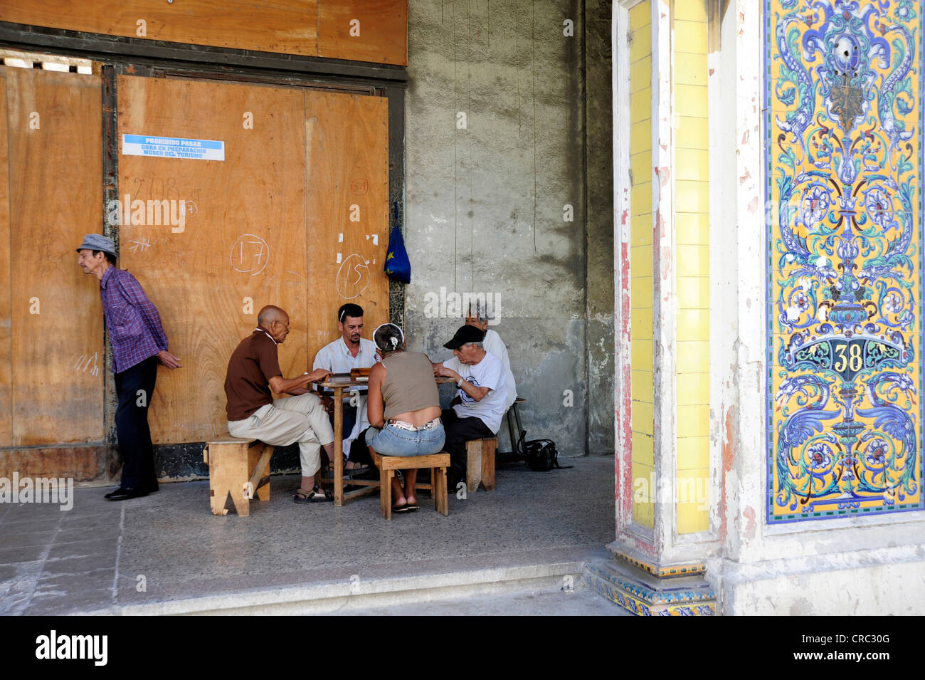 Men playing dominoes on the street, Avenida de Italia, Galiano, city centre of Havana, Centro Habana, Cuba, Greater Antilles Stock Photo