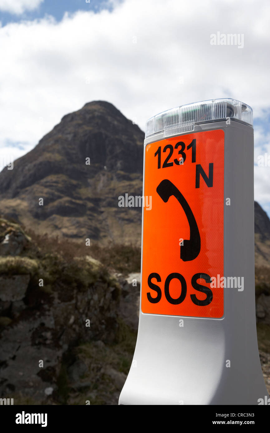 emergency phone in front of buachaille etive beag in glencoe highlands scotland uk Stock Photo