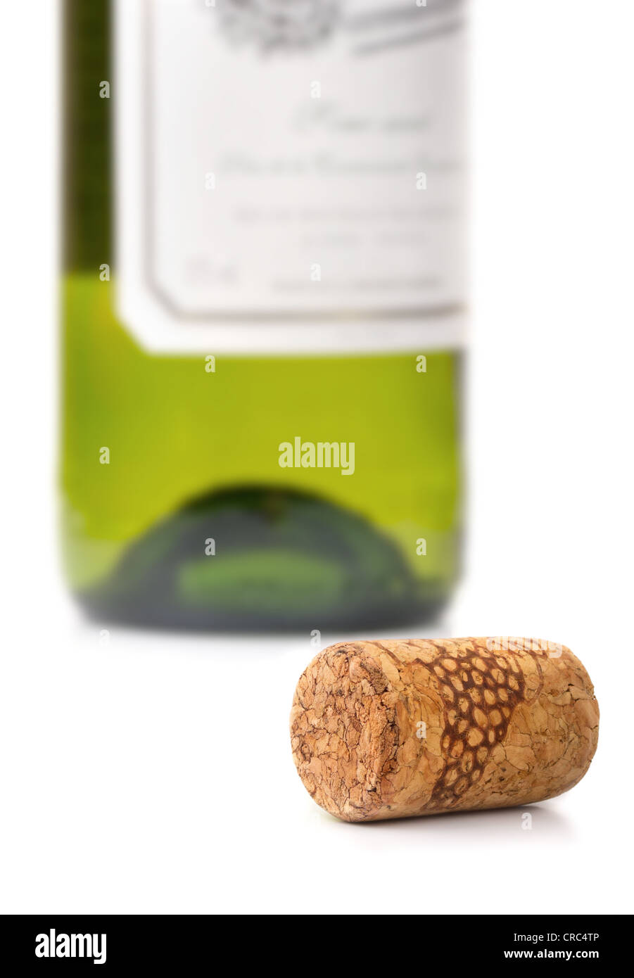Wine cork and bottle of white wine on white background Stock Photo