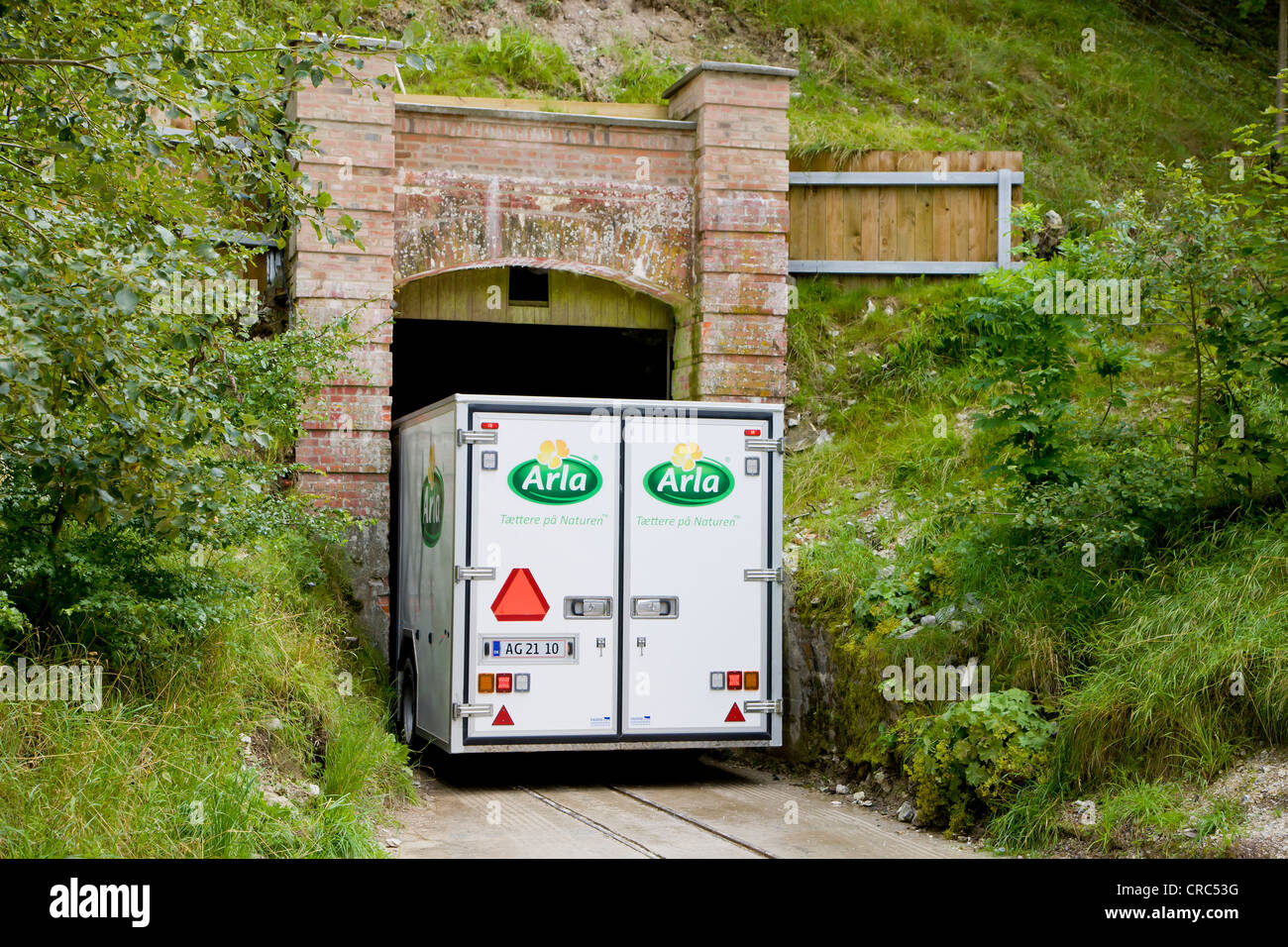Cheese transporter passing narrow tunnel to the Mønsted, Monsted limestone caves near Viborg, Jutland, Denmark, Europe Stock Photo