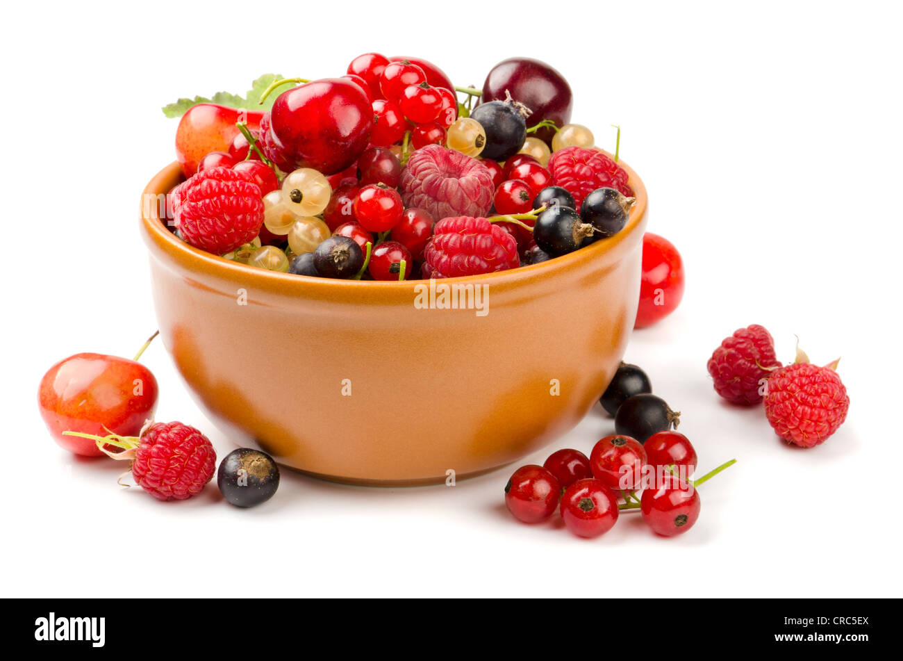 Mixed berries in bowl isolated on white Stock Photo