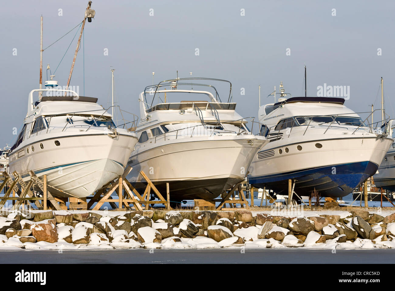 Three drydocked motor boats in Dragoer harbour, Denmark, Europe Stock Photo