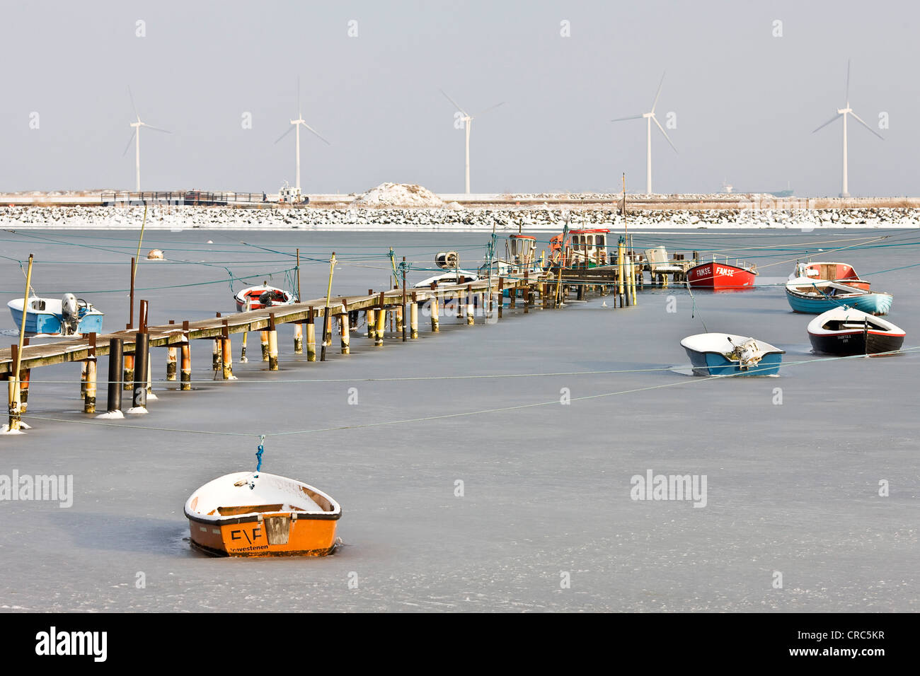 Small icebound boats at the coast of Amager, Denmark, Europe Stock Photo