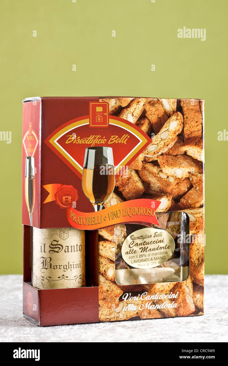 Present box with Vin Santo dessert wine and almond cookies Stock Photo