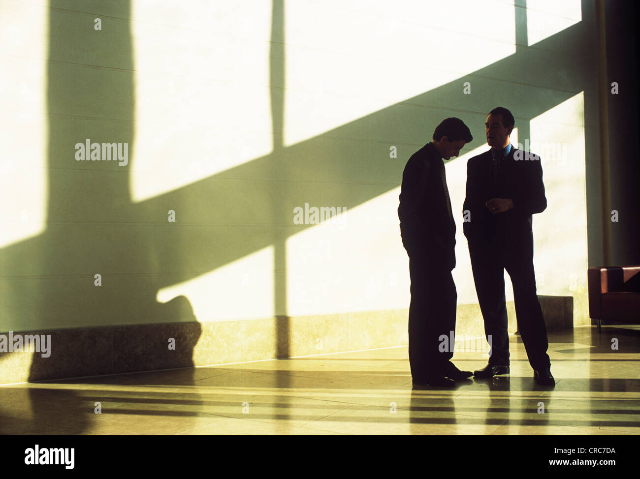 Silhouette of two men in discussion hi-res stock photography and images ...
