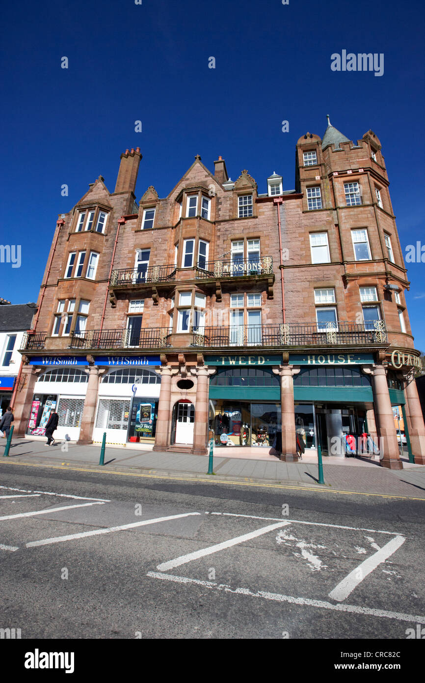 argyll mansions historic sandstone building with tweed house shop now a block of holiday self catering apartments oban scotland Stock Photo