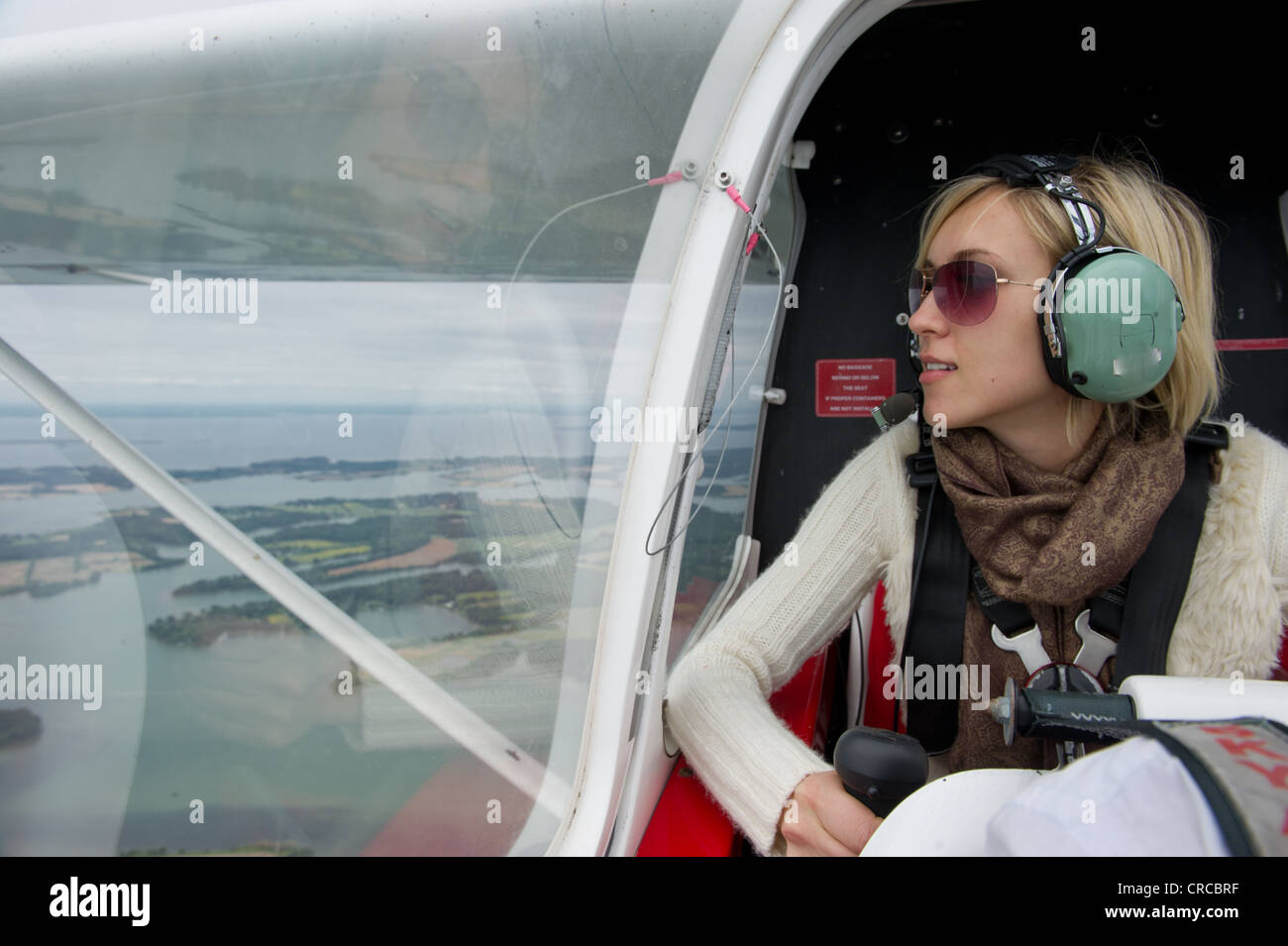 Female passenger in small private plane Stock Photo