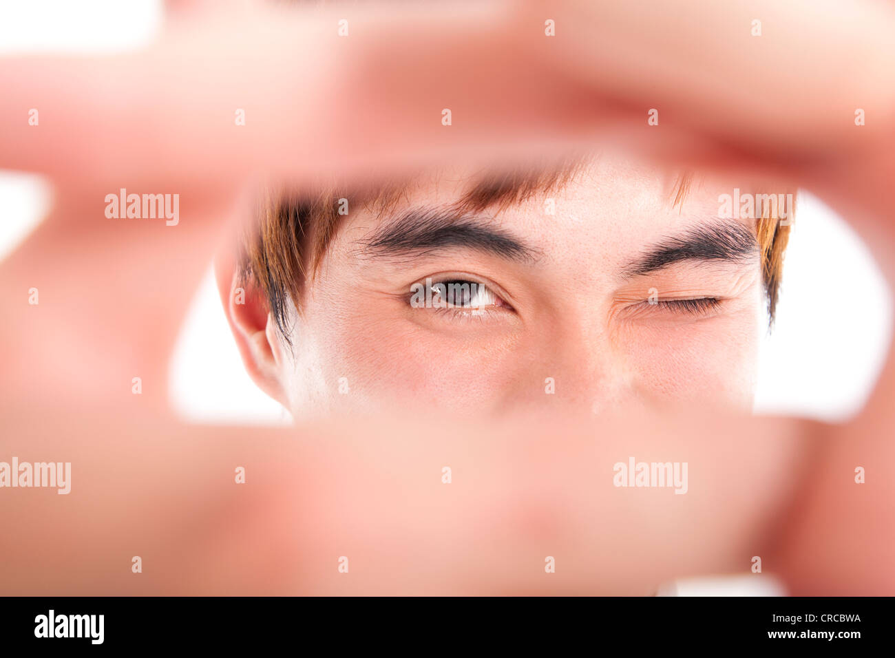 young man showing thinking outside the square concept Stock Photo