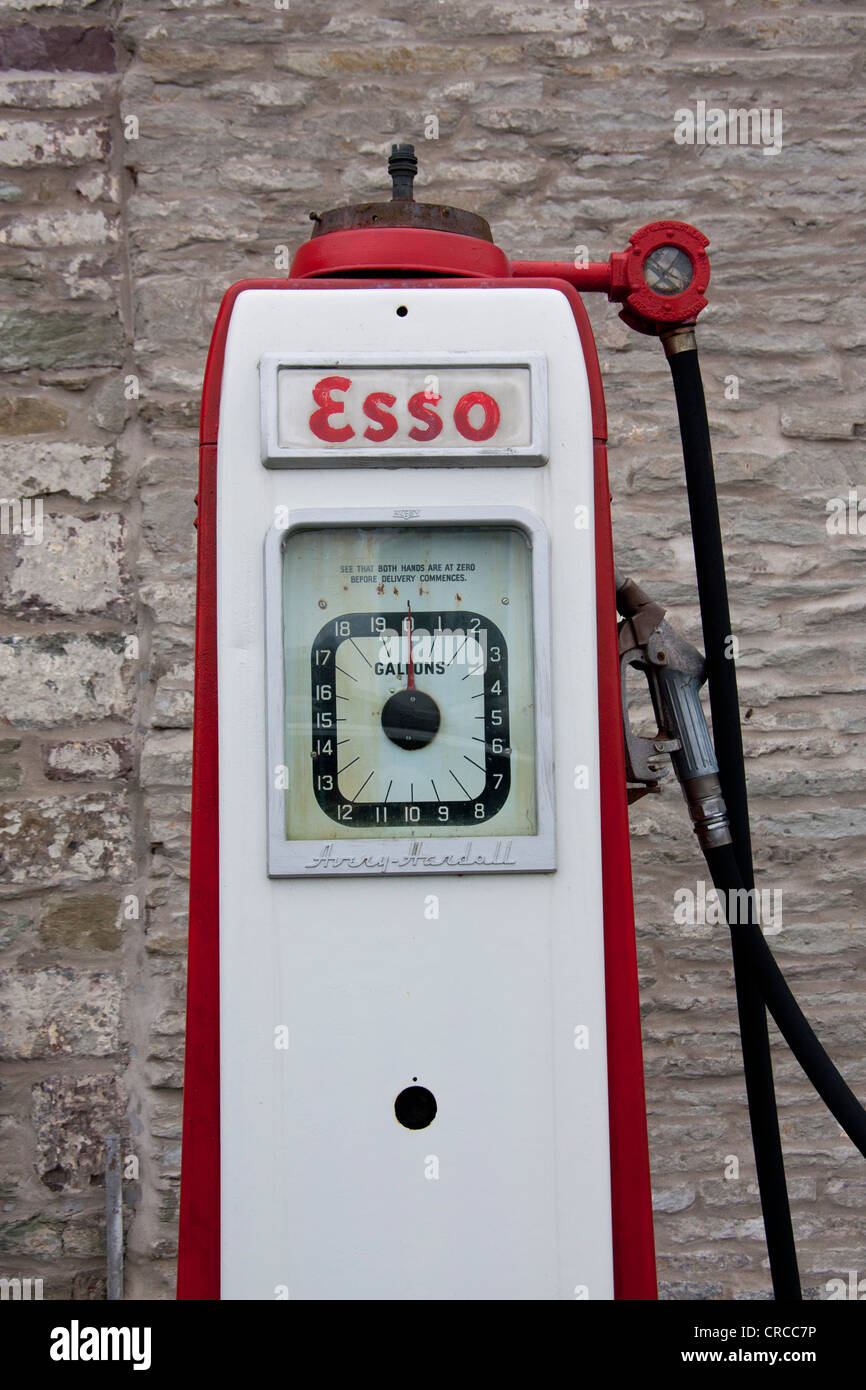 Vintage Avery Hardoll Esso petrol pump with stone wall background ...