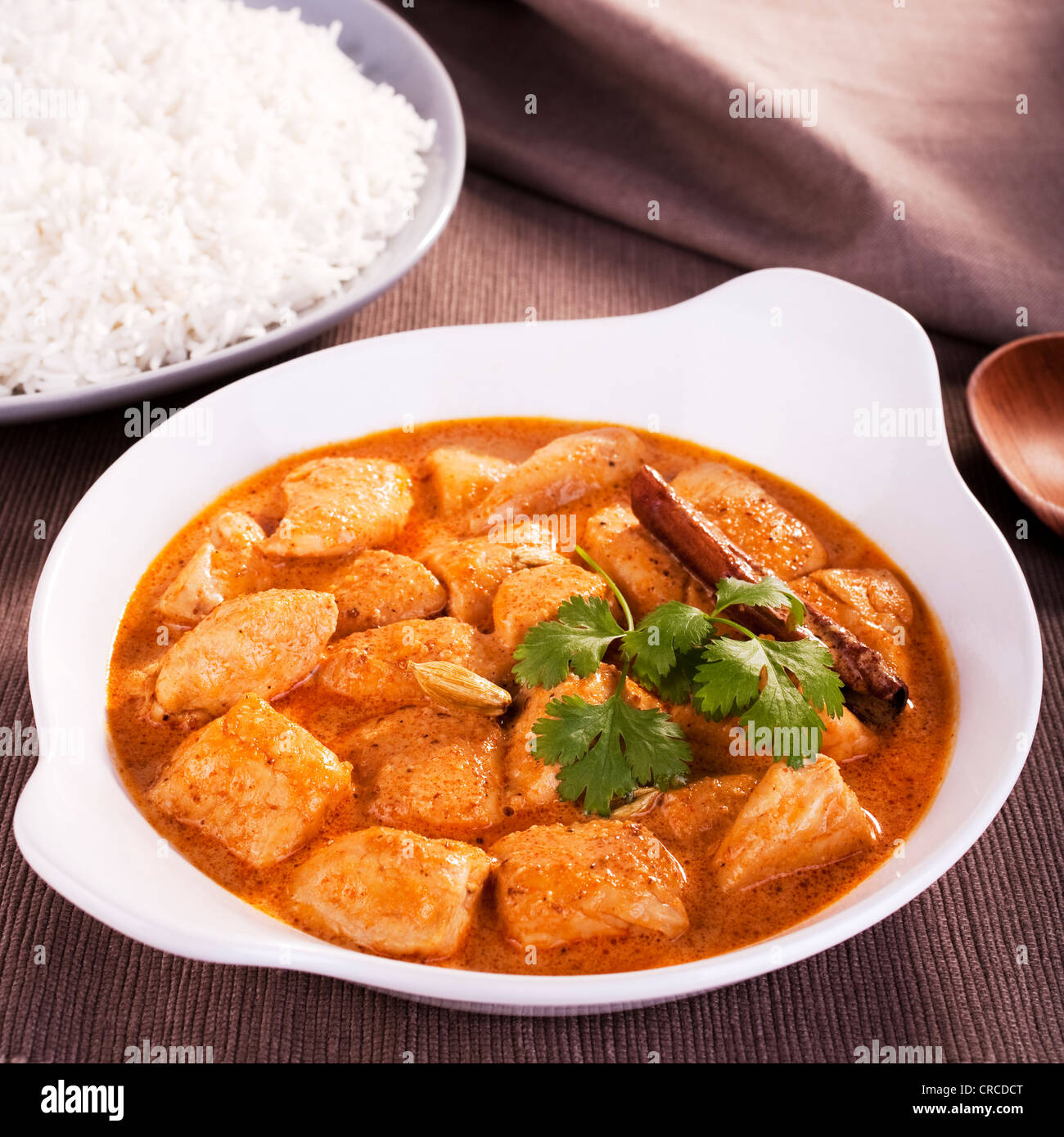 Indian favourite curry, butter chicken, garnished with coriander