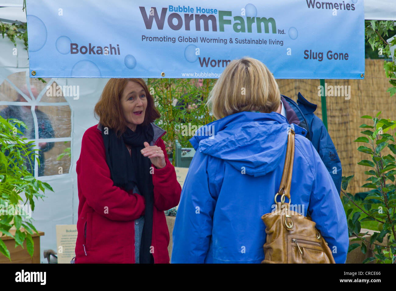 Stallholder talks to customers at Bubble House worm Farm stall at RHS