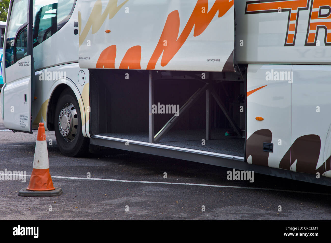Side of a coach showing the large luggage loading area Stock Photo