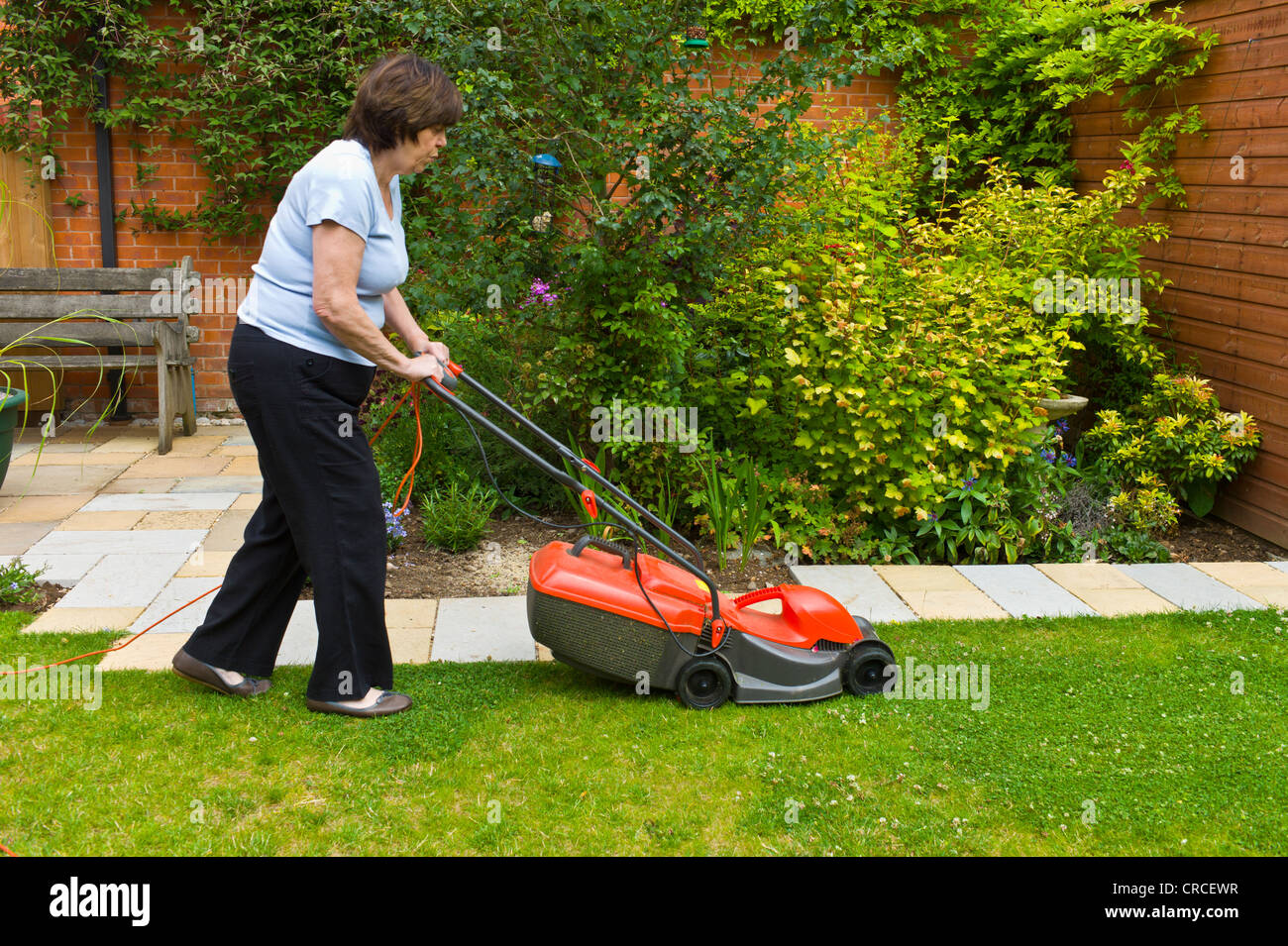 Lawn mower woman hi-res stock photography and images - Page 11 - Alamy