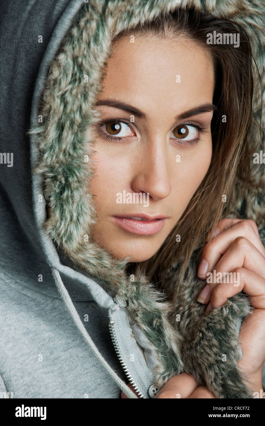 Young woman wearing fur hood hi-res stock photography and images - Alamy