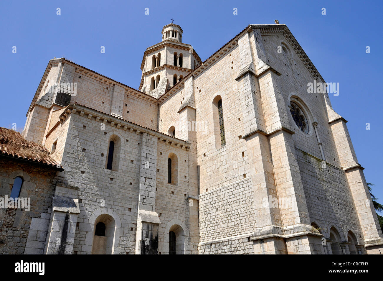 Transept, bell tower and apse of the Gothic basilica of the Cistercian monastery Fossanova Abbey near Priverno, Lazio, Italy Stock Photo