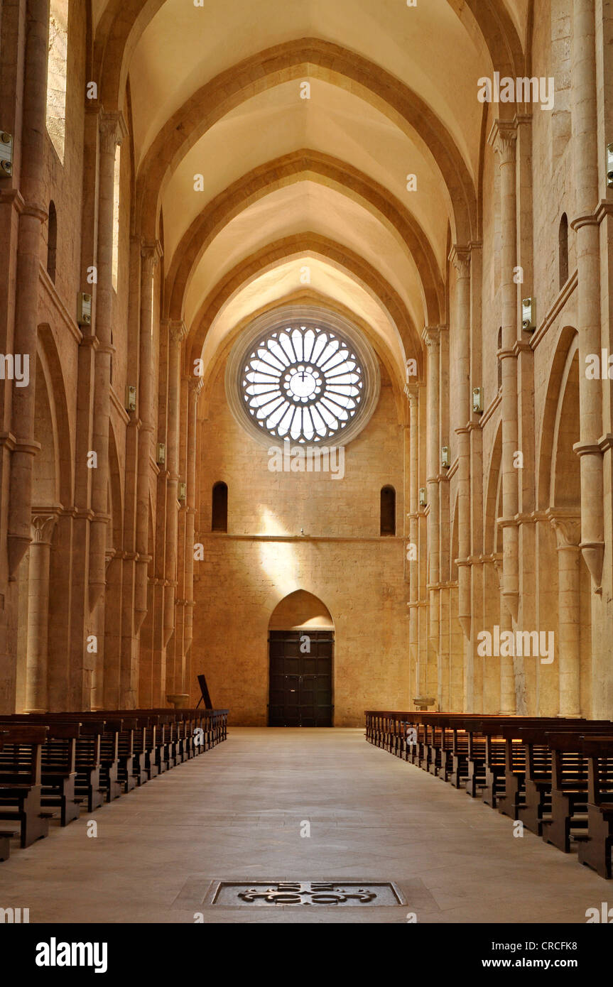 Interior view, nave with rose window above the portal of the Gothic basilica of the Cistercian monastery Fossanova Abbey Stock Photo