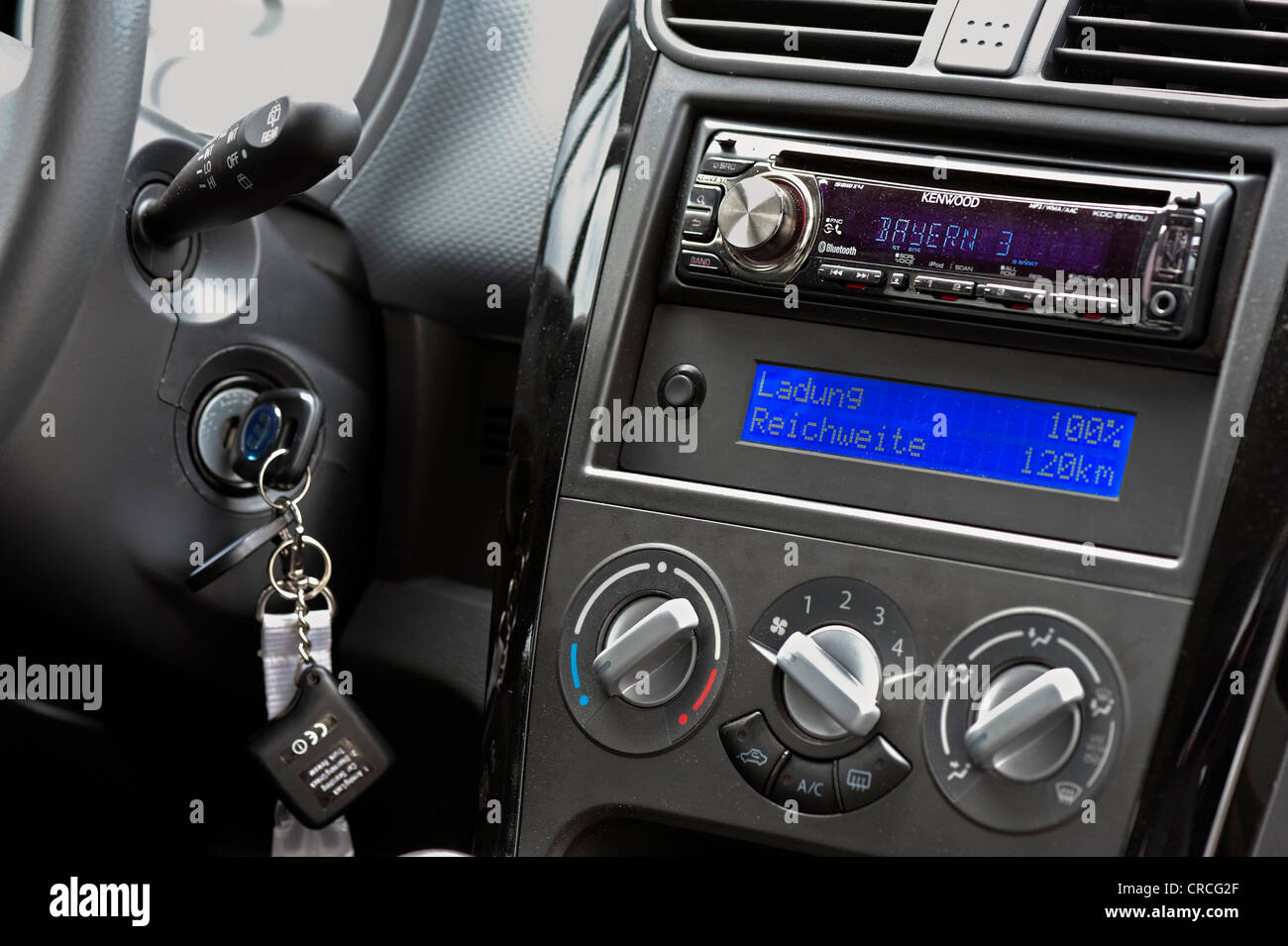Display on the dashboard of a Suzuki Splash electric car, display showing  that the battery is 100 per cent charged Stock Photo - Alamy