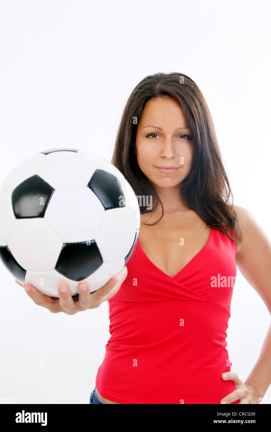 young cute woman in red top with soccer ball Stock Photo