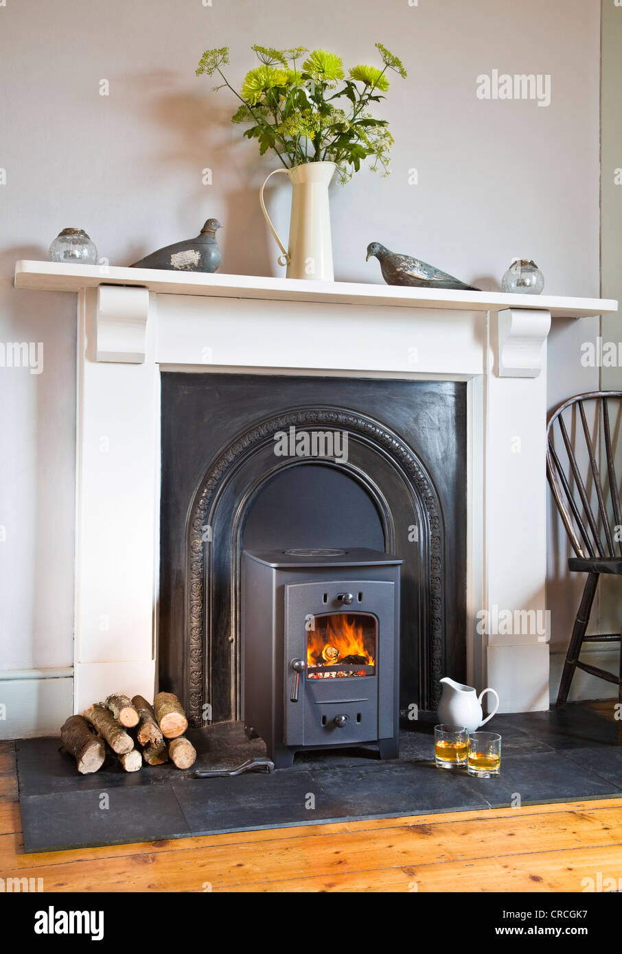 Wood burning stove in tasteful period interior Stock Photo