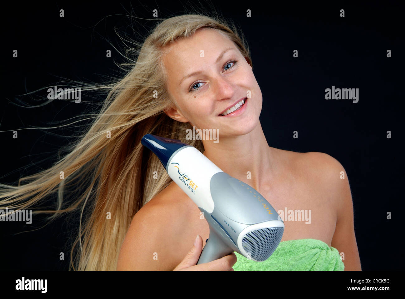 Woman drying hair in front hi-res stock photography and images - Alamy