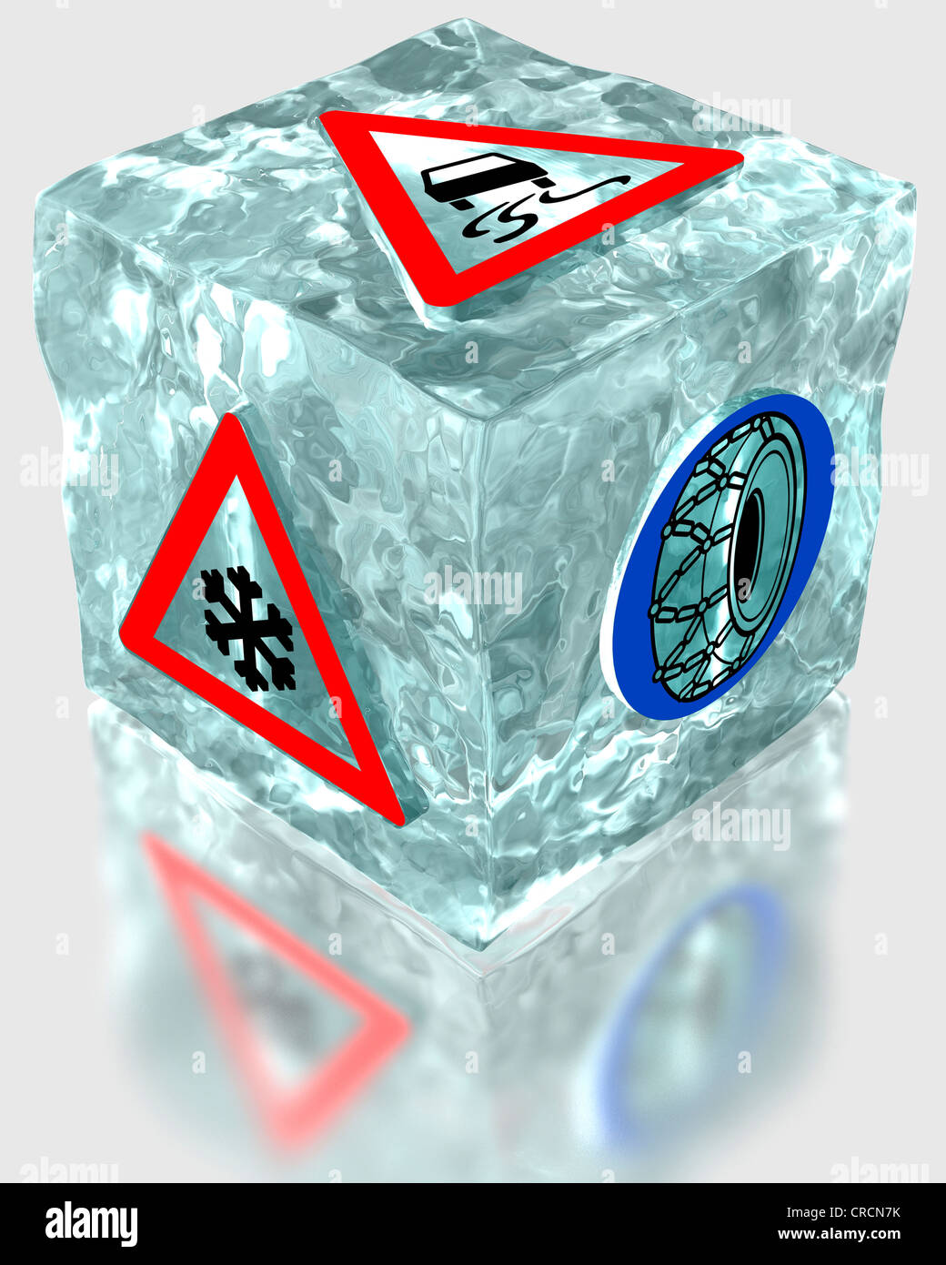 Block of ice with traffic warning signs for snow and icy roads